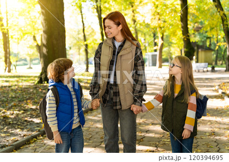 Children walking outdoors in social gathering in park enjoying free time together with fun Children walking outdoors in social gathering in park enjoying free time together with fun 120394695