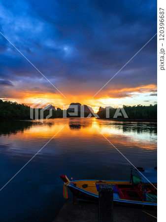 Beautiful sunrise behind the island ridge. 120396687