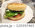 Smoked salmon bagel on white plate 120397465