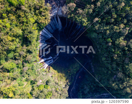 Aerial view of Panorama Tumpak Sewu Waterfalls also known as Coban Sewu.Beautiful rainbow and fog,Tumpak Sewu Waterfalls are a tourist attraction in East Java, Indonesia.Amazing travel destination 120397590