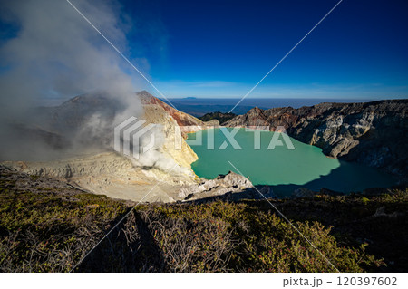 Aerial view Kawah Ijen volcano with turquoise sulfur water lake at sunrise.Amazing nature landscape view at East Java, Indonesia. Natural landscape background 120397602