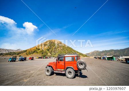 Java Indonesia on September 11,2024 : Tourists 4x4 red Jeep for tourist rent at Mount Bromo,The active Mount Bromo is popular visited tourist attractions in East Java, Indonesia 120397607