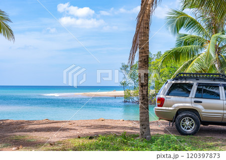 Phuket Thailand November 19, 2024: Brown American SUV Jeep Grand Cherokee WJ 2002 near the sea in Phuket Thailand,Off-road over land,View of the sea and dirt road nature landscape Phuket Thailand November 19, 2024: Brown American SUV Jeep Grand Cherokee WJ 2002 near the sea in Phuket Thailand,Off-road over land,View of the sea and dirt road nature landscape 120397873