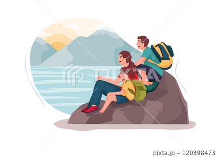 A small family is watching the sunset on the rock. 120398473