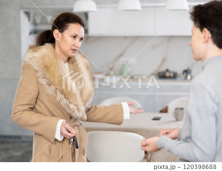 Mother leaving house, son staying home 120398688