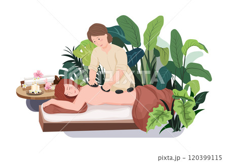 Woman doing massage to a woman with rocks. 120399115