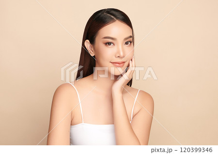 Beautiful young asian woman with clean fresh skin on beige background, Face care, Facial treatment, Cosmetology, beauty and spa, Asian women portrait. 120399346