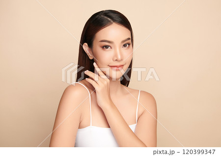 Beautiful young asian woman with clean fresh skin on beige background, Face care, Facial treatment, Cosmetology, beauty and spa, Asian women portrait. Beautiful young asian woman with clean fresh skin on beige background, Face care, Facial treatment, Cosmetology, beauty and spa, Asian women portrait. 120399347