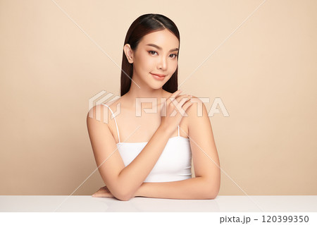 Beautiful young asian woman with clean fresh skin on beige background, Face care, Facial treatment, Cosmetology, beauty and spa, Asian women portrait. Beautiful young asian woman with clean fresh skin on beige background, Face care, Facial treatment, Cosmetology, beauty and spa, Asian women portrait. 120399350