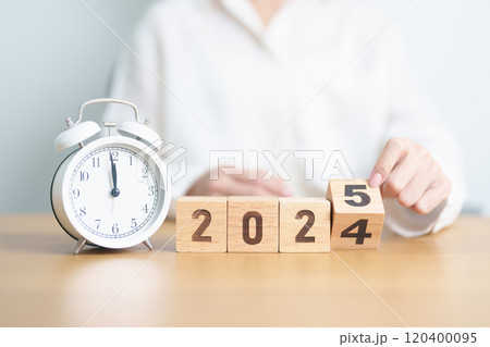 2024 end year to Happy New Year 2025 with vintage alarm clock. Christmas, New Start, Resolution, countdown, Goals, Plan, Action and Motivation Concept 120400095