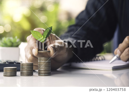Hand with money coins stack, Business investment growth concept, saving concept, Hand putting stack of coin. Hand with money coins stack, Business investment growth concept, saving concept, Hand putting stack of coin. 120403758