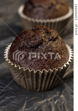 fresh and soft black chocolate cupcake on black paper 120404947