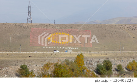 the flag of Kyrgyzstan on the hill, built by stone and sand 120405227