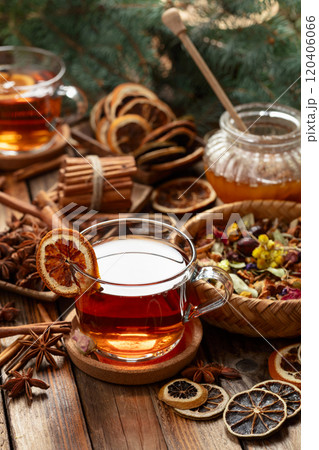 Christmas herbal tea with ingredients on a old wooden table. Christmas herbal tea with ingredients on a old wooden table. 120406066
