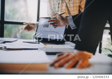 Fund managers team consultation and discuss about analysis Investment stock market at office 120406333
