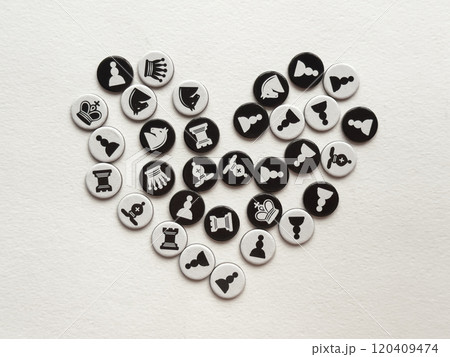 Chess themed heart shape with black and white game pieces on white background Chess themed heart shape with black and white game pieces on white background 120409474