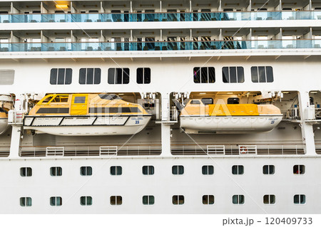 Close-up of enclosed lifeboats on a cruise ship in Kaohsiung, Taiwan. 120409733