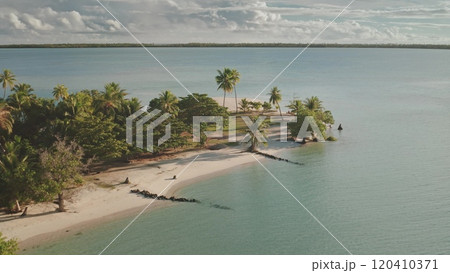 Aerial drone fly over tropical island beach with white sand, palm trees and crystal sea water. Maupiti, French Polynesia. Remote wild nature place to visit, exotic summer vacation, travel background Aerial drone fly over tropical island beach with white sand, palm trees and crystal sea water. Maupiti, French Polynesia. Remote wild nature place to visit, exotic summer vacation, travel background 120410371