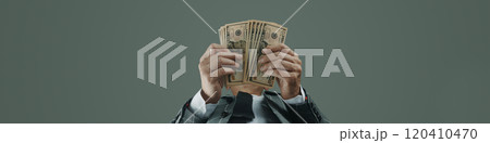 businessman with some dollar notes, banner format businessman with some dollar notes, banner format 120410470