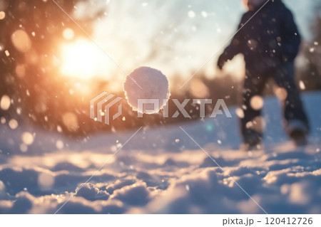 Joyful Kid Throwing Snowball in Snowy Landscape Joyful Kid Throwing Snowball in Snowy Landscape 120412726