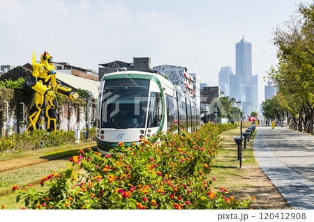 The circular light rail train drives past Pier-2 Art Center in Kaohsiung, Taiwan. 120412908