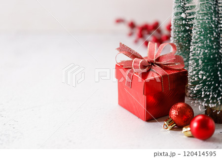 Red gift box on white marble background. Christmas New year concept. Selective focus. 120414595