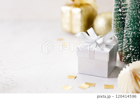 white gift box on white marble background. Christmas New year concept. Selective focus. white gift box on white marble background. Christmas New year concept. Selective focus. 120414596