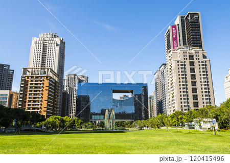 View of the park and surrounding modern buildings in front of Taichung City Council, Taiwan. 120415496