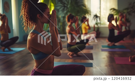 Diverse Yogis in Luminous Studio Move Through Fluid Vinyasa Sequence 120416932