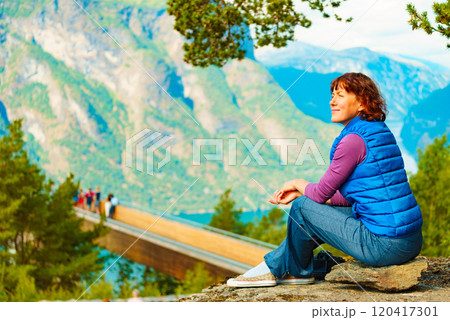 Tourist enjoying mountains fjord view, Norway 120417301