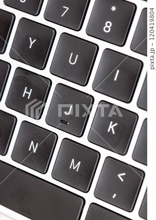 keyboard of famous silver colored laptop with fingerprints keyboard of famous silver colored laptop with fingerprints 120419804