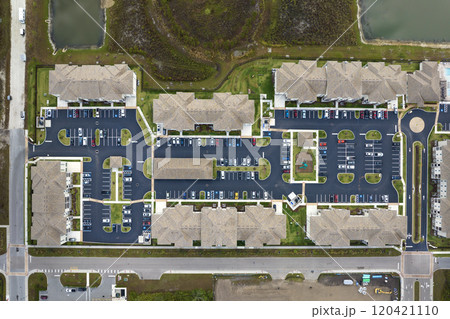 View from above of apartment residential condos in Florida suburban area. American condominiums as example of real estate development in USA suburbs View from above of apartment residential condos in Florida suburban area. American condominiums as example of real estate development in USA suburbs 120421110