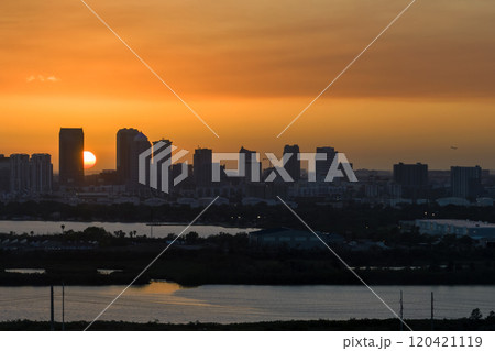 Urban sunset landscape of downtown district of Tampa city in Florida, USA. Dramatic skyline with high skyscraper buildings in modern American megapolis Urban sunset landscape of downtown district of Tampa city in Florida, USA. Dramatic skyline with high skyscraper buildings in modern American megapolis 120421119