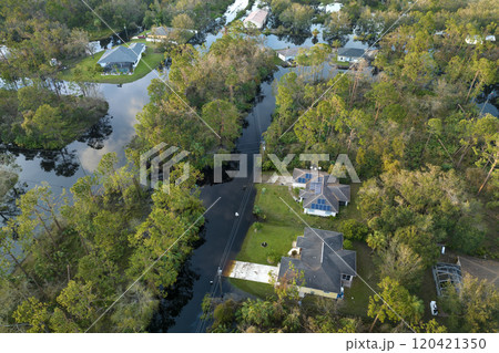Surrounded by hurricane rainfall flood waters homes in Florida residential area. Aftermath of natural disaster Surrounded by hurricane rainfall flood waters homes in Florida residential area. Aftermath of natural disaster 120421350
