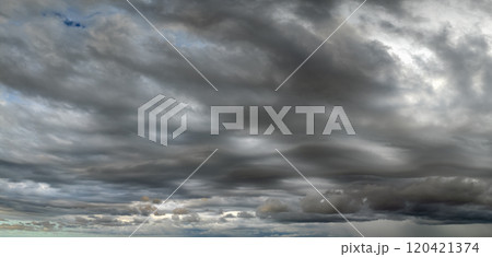 Stormy cumulus clouds forming during heavy thunderstorm on dark sky. Moving and changing cloudscape weather Stormy cumulus clouds forming during heavy thunderstorm on dark sky. Moving and changing cloudscape weather 120421374