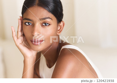Elegant Woman With Serene Expression Posing Indoors in Natural Light Elegant Woman With Serene Expression Posing Indoors in Natural Light 120421938