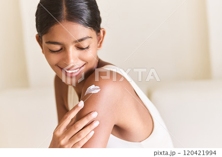 Smile While Applying Moisturizing Cream On Shoulder For Healthy Skin Smile While Applying Moisturizing Cream On Shoulder For Healthy Skin 120421994