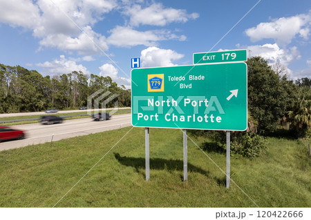 Highway interchange exit sign with direction to North Port and Port Charlotte in Florida. Interstate freeway travel in USA 120422666