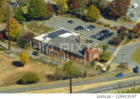 Blue photovoltaic solar panels mounted on residential building roof for producing clean ecological electricity. Production of renewable energy concept 120423247