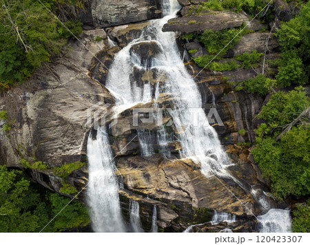 Amazing summer landscape with forest river waters falling down in big waterfall with clear water between rocky boulders in Nantahala National Forest. Whitewater Falls, North Carolina, USA 120423307