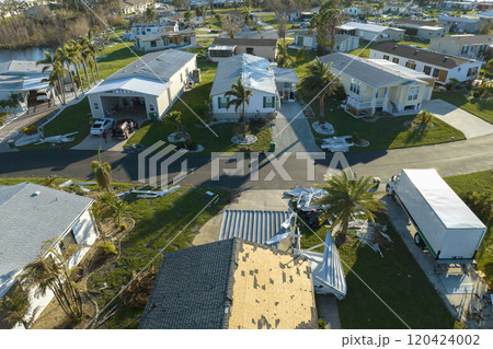 Aerial view of natural disaster consequences in Florida Southwest region. Severely damaged by hurricane Ian mobile homes in residential area 120424002