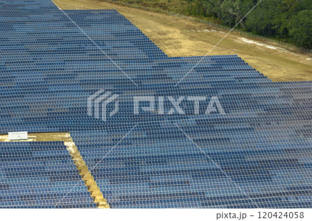 Aerial view of big sustainable electric power plant with many rows of solar photovoltaic panels for producing clean electrical energy. Renewable electricity with zero emission concept 120424058