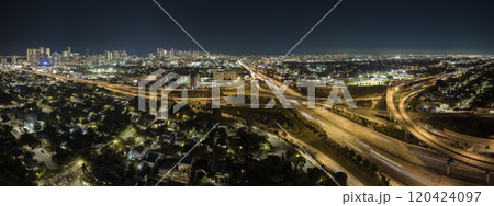 Above view of wide highway crossroads in Miami, Florida at night with fast driving cars. USA transportation infrastructure concept 120424097