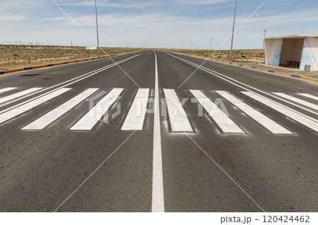 Asphalt road with pedestrian crossing and bus stop. Asphalt road in Kazakhstan. Mangystau Region Asphalt road with pedestrian crossing and bus stop. Asphalt road in Kazakhstan. Mangystau Region 120424462