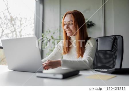 Happy Woman Working at Laptop Happy Woman Working at Laptop 120425213