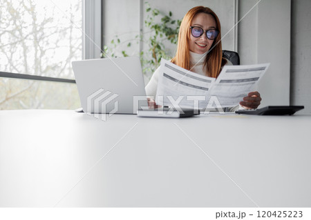 Smiling Woman Working in Modern Office 120425223