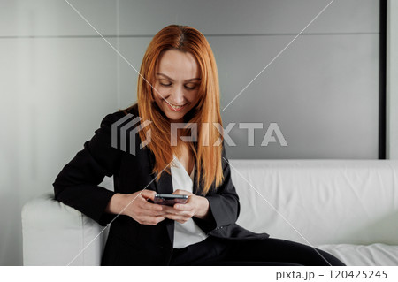 Businesswoman Using Smartphone 120425245