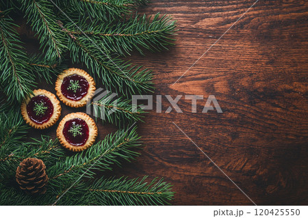 Traditional Linzer Christmas Cookies with raspberry or strawberry jam on wooden table. Top view. Copy space 120425550