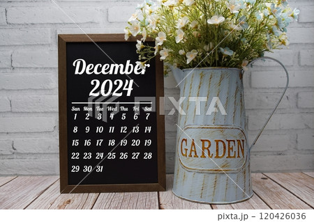 December 2024 monthly calendar on chalkboard for planning and management 120426036
