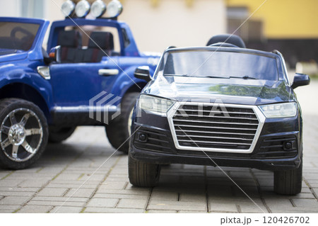 Children's toy black and blue cars on the road. Children's toy black and blue cars on the road. 120426702